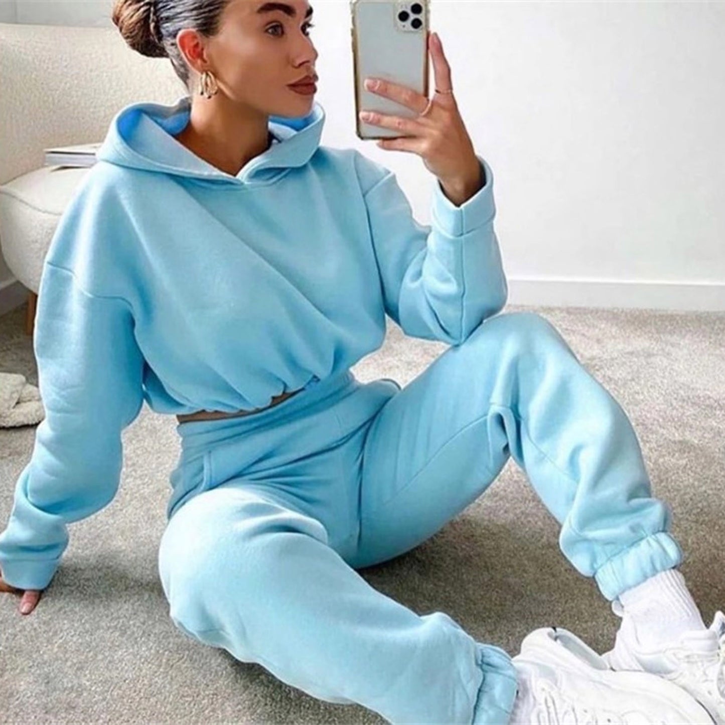 Light blue 2 piece sports outfit for women featuring a cropped hoodie and matching joggers