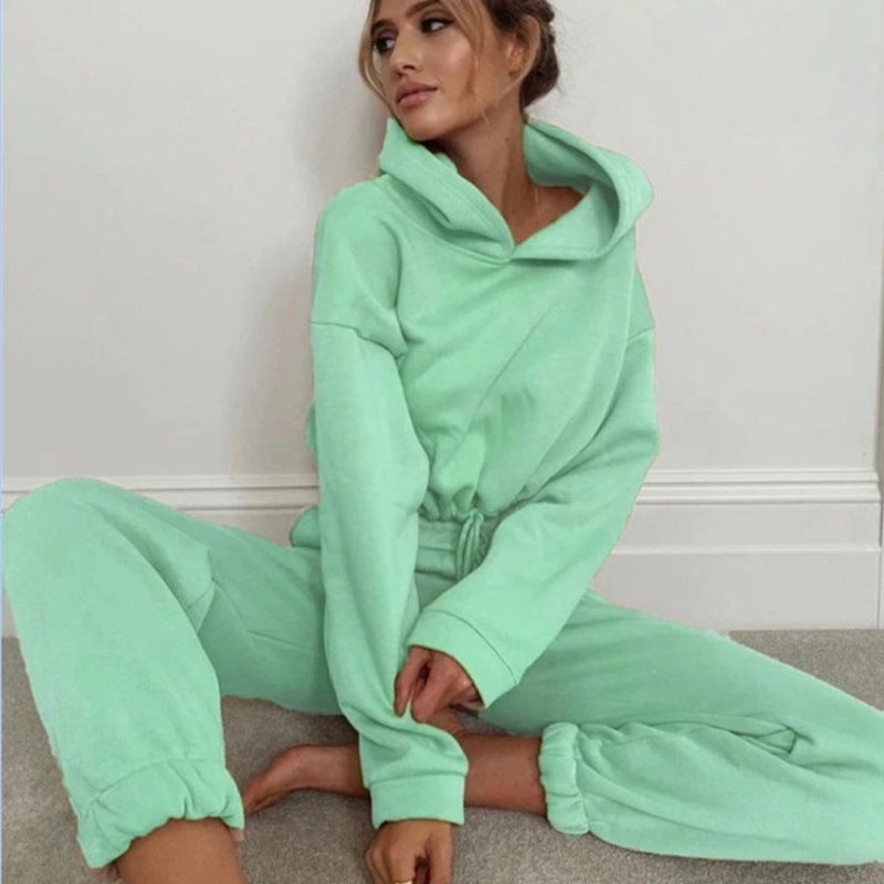 Stylish mint green 2 piece sports outfit for women featuring a cozy hooded top and jogger pants