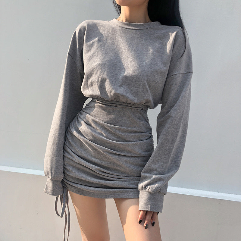 American athleisure sweater dress in gray with gathered design and long sleeves for a trendy look