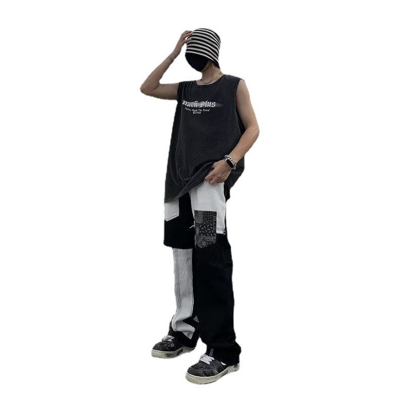 Model wearing American street style hip hop jeans with a trendy oversized tank and beanie