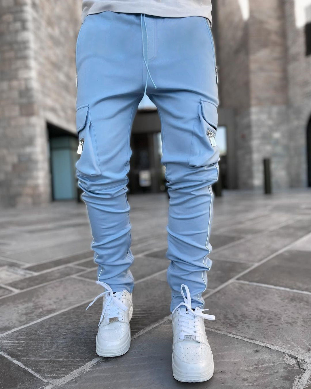 Light blue athleisure cargo pants with stylish pockets, perfect for casual and active wear