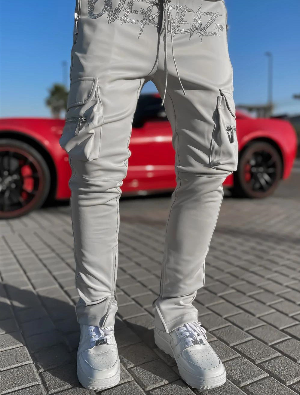 Stylish athleisure cargo pants in light grey with functional pockets and a slim fit