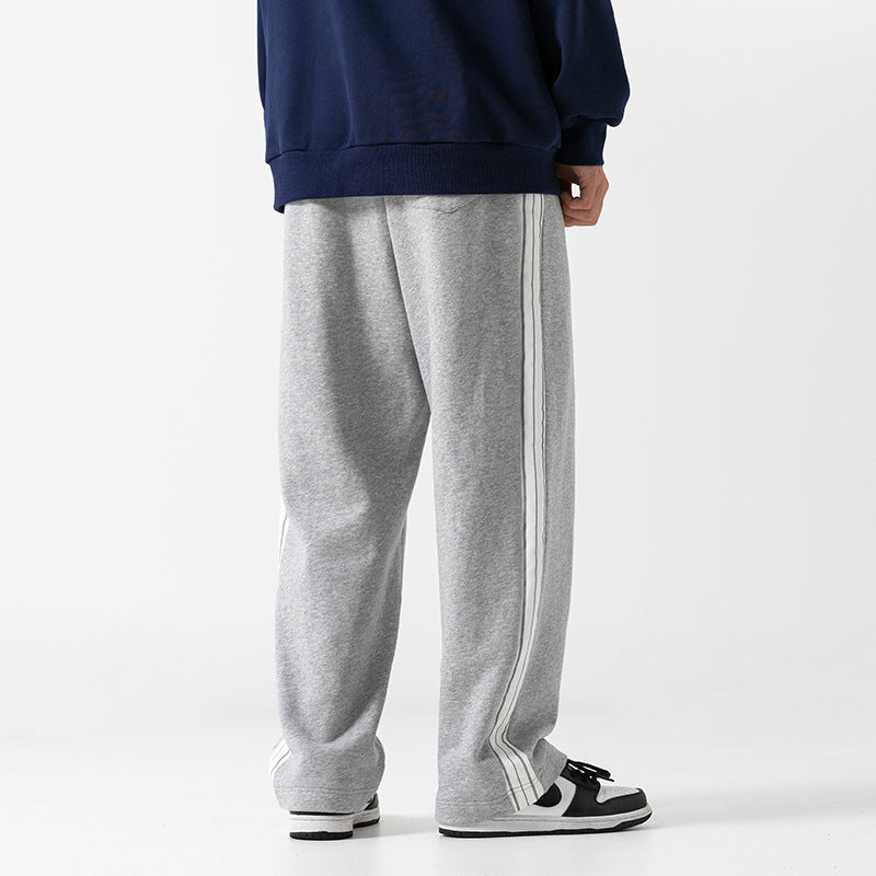 Comfortable gray loose athleisure pants men with side stripes for casual and active wear