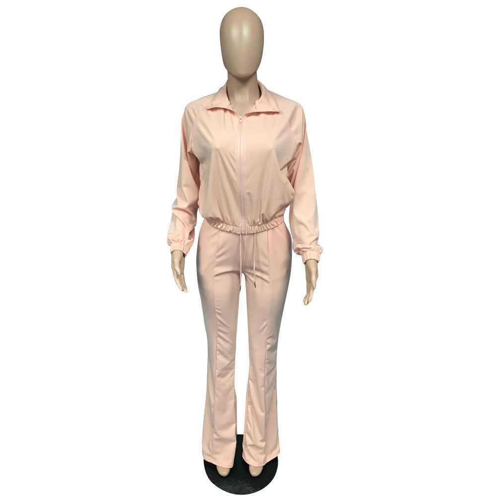 Light pink athleisure two piece set featuring a zip-up top and matching pants for comfortable wear