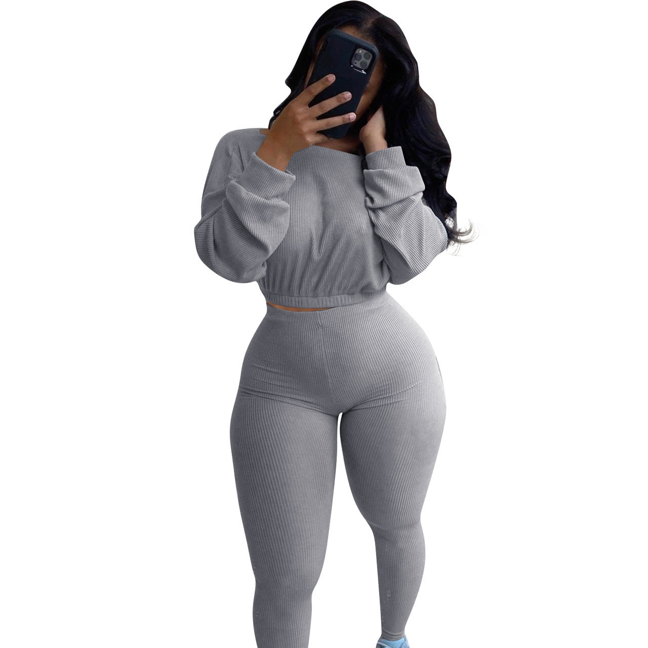 Grey autumn ribbed athleisure suit featuring a cropped top and high-waisted leggings for a stylish look