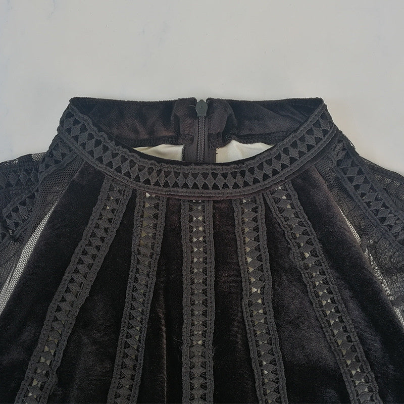 Close-up of the neckline of a beaded sheer dress featuring intricate detailing and a stylish design