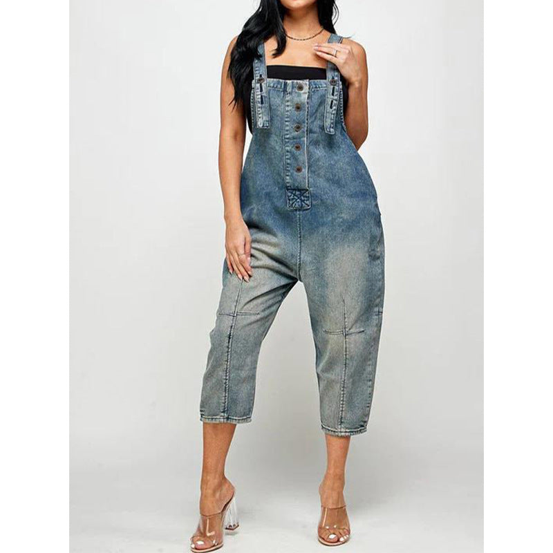 Casual fashion jeans overalls in light blue denim with adjustable straps and button detailing