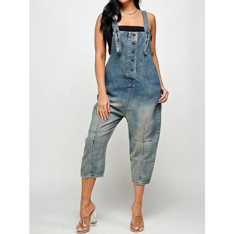 Stylish casual fashion jeans overalls in faded denim with adjustable straps and a relaxed fit