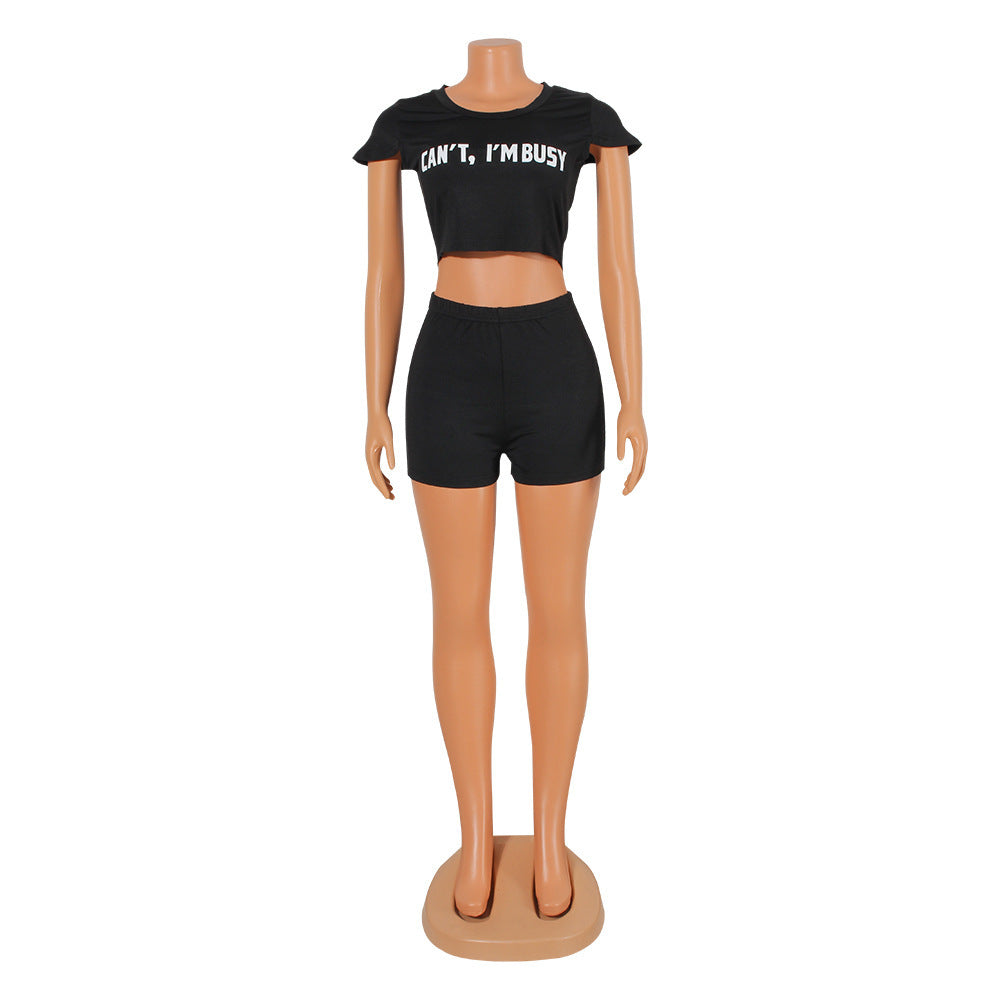 Black casual sporty suit for women featuring a cropped top with text and matching shorts