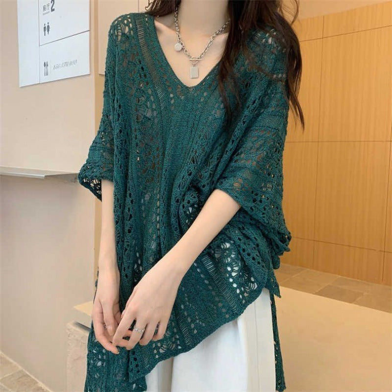Chic loose smock top in teal with a V-neck design and relaxed fit for casual styling