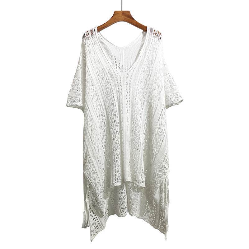 Chic loose smock top in white with intricate lace detailing and a relaxed fit for stylish layering
