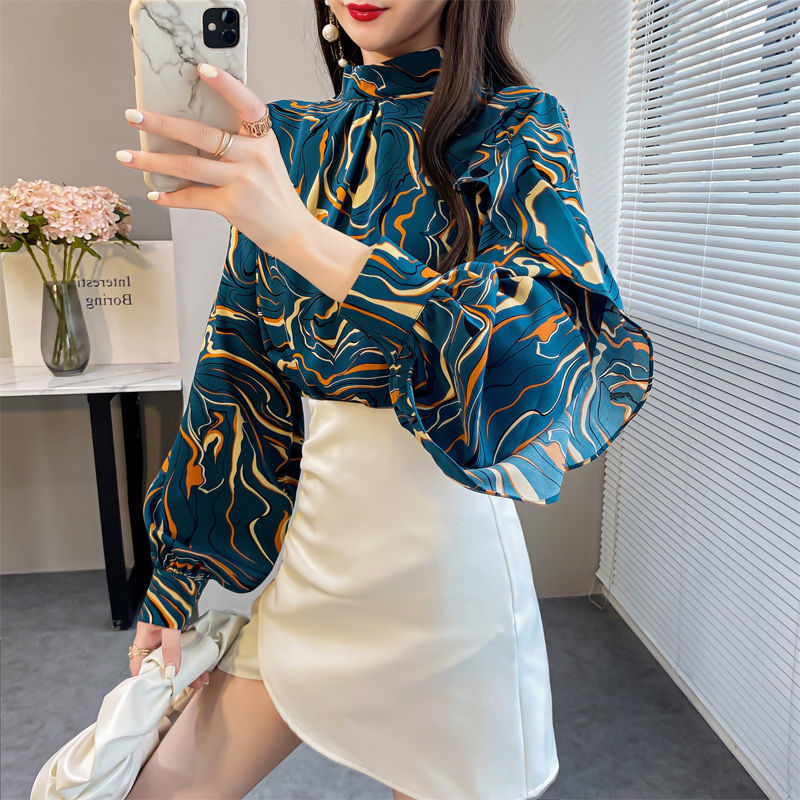 Chic ruffle top for women in teal with vibrant abstract pattern and puffed sleeves, perfect for stylish outfits