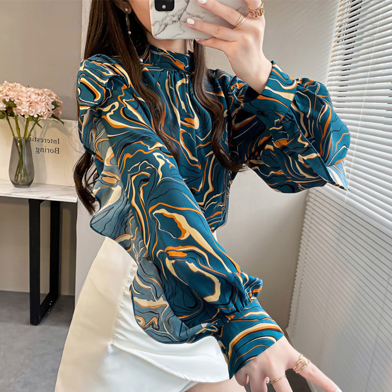 Chic ruffle top for women in teal with abstract print and long sleeves, perfect for casual outings