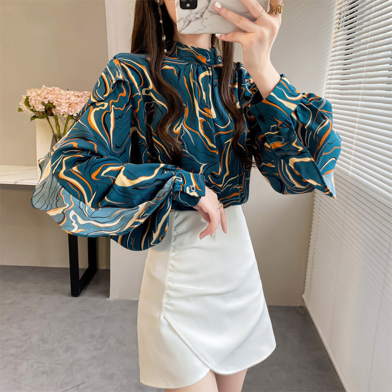 Chic ruffle top for women in colorful marbled pattern paired with a stylish white mini skirt