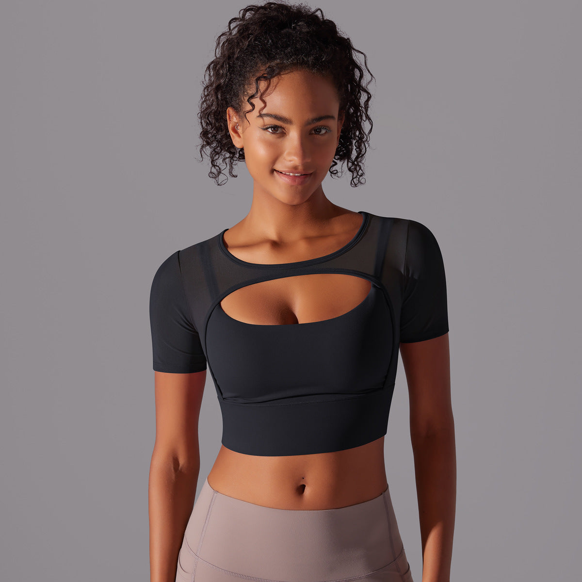 Stylish double layer yoga top for women with a trendy cutout design and short sleeves