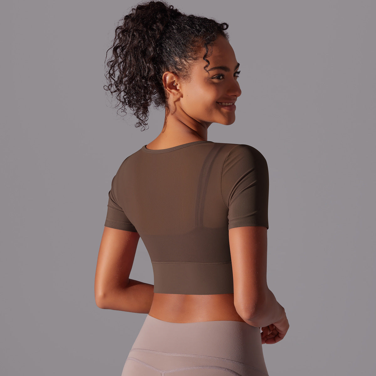 Stylish double layer yoga top for women in brown with a modern cropped design and short sleeves