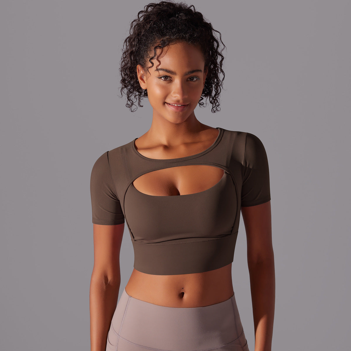 Stylish double layer yoga top for women in olive green with a modern cut-out design