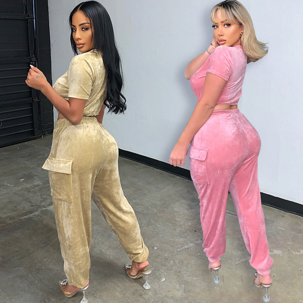 Two models wearing gold velvet athleisure set and pink jumpsuit, showcasing comfy fashion style