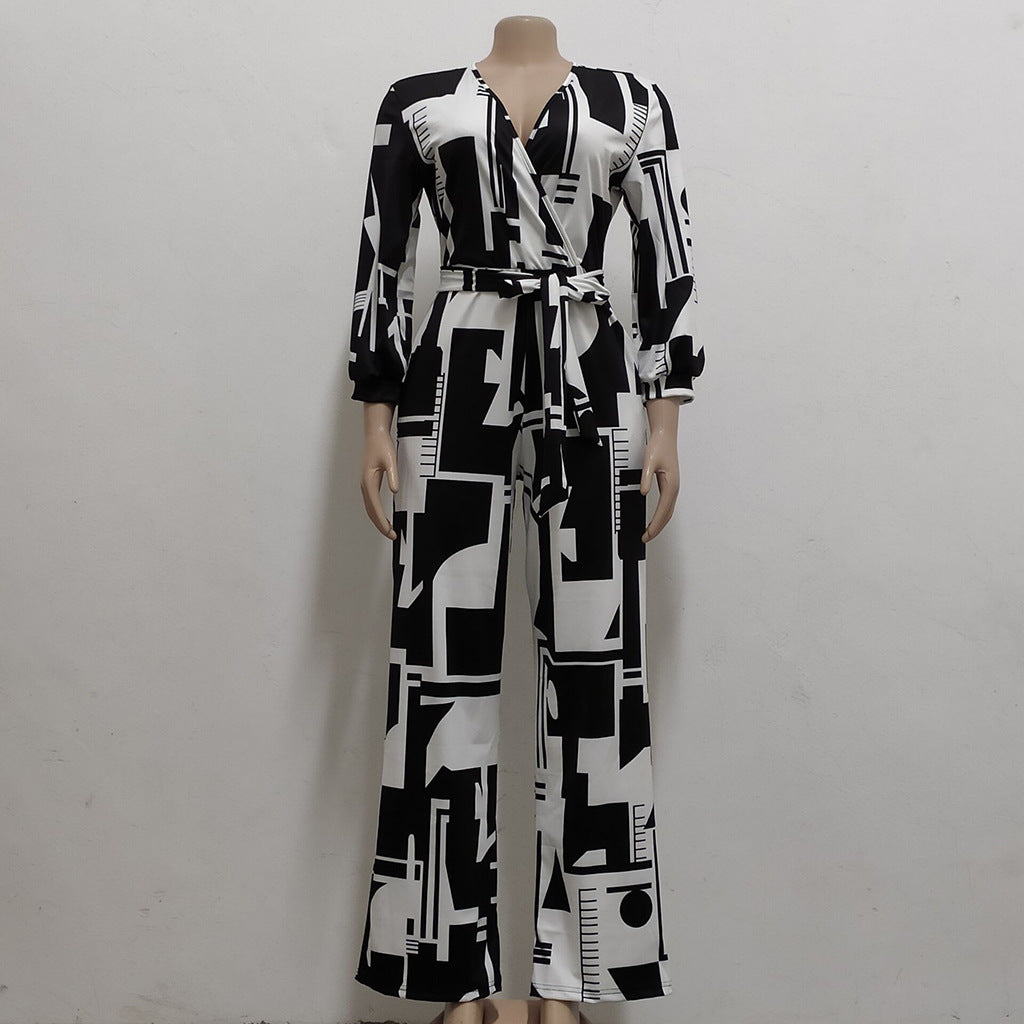 Chic long sleeve ladies jumpsuit in black and white geometric print with a flattering belted waist