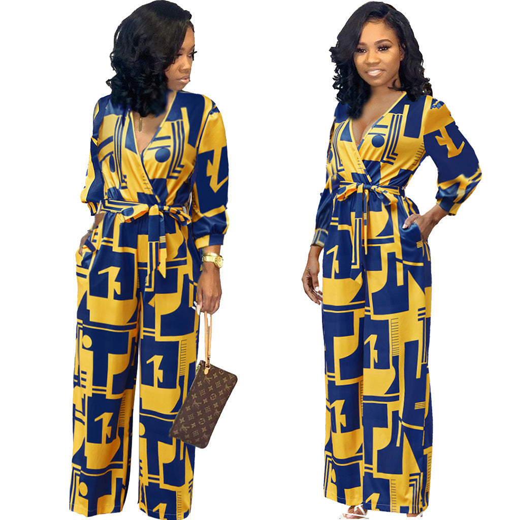 Fashionable long sleeve ladies jumpsuit in bold yellow and blue geometric pattern with stylish waist tie