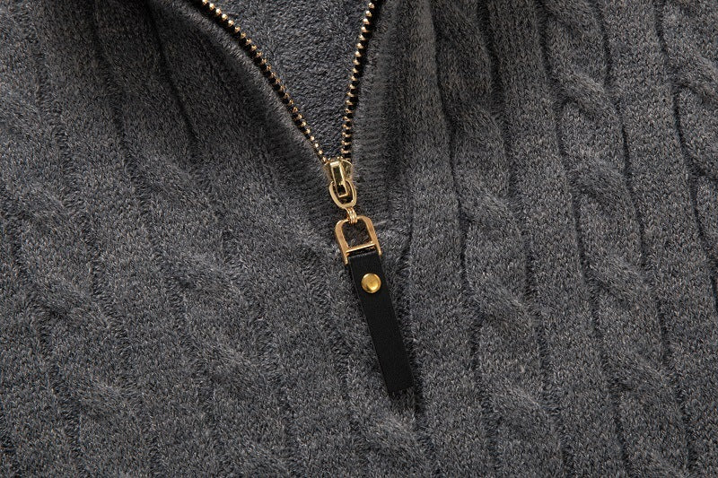 Gray long sleeve cable knit pullover with gold zipper detail for a cozy and stylish look