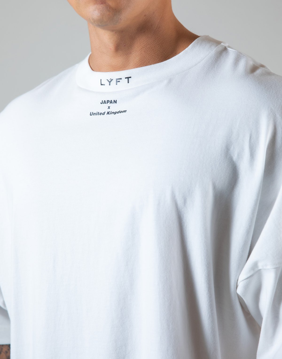 White round neck athleisure shirt with LYFT logo and Japan United Kingdom print for casual wear