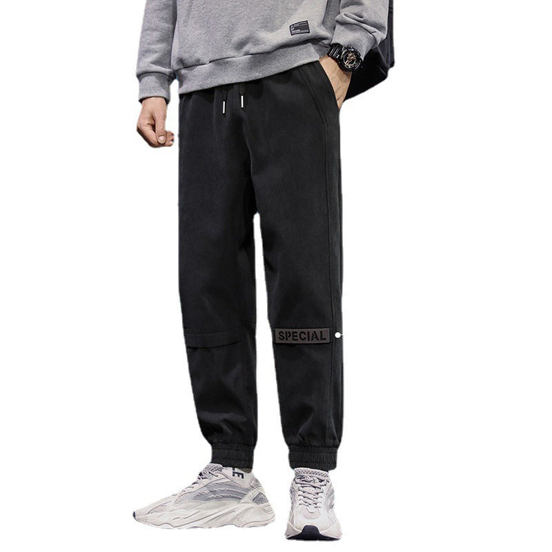 Men's reflective athleisure pants in black with comfortable fit and stylish design for everyday wear