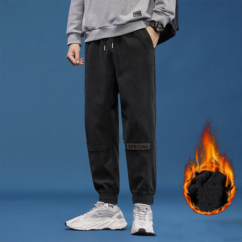 Men's reflective athleisure pants in black with an adjustable waistband and stylish pockets