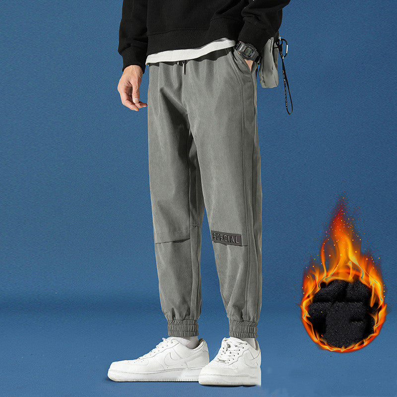 Men's reflective athleisure pants in gray with a modern fit and stylish design for active wear.