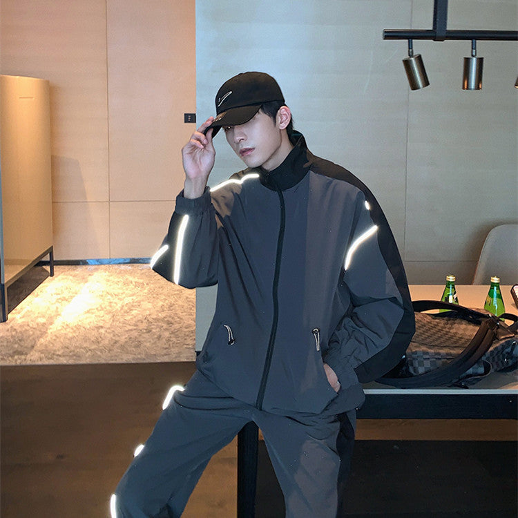 Men's reflective athleisure two piece set featuring a stylish zip-up jacket and matching pants