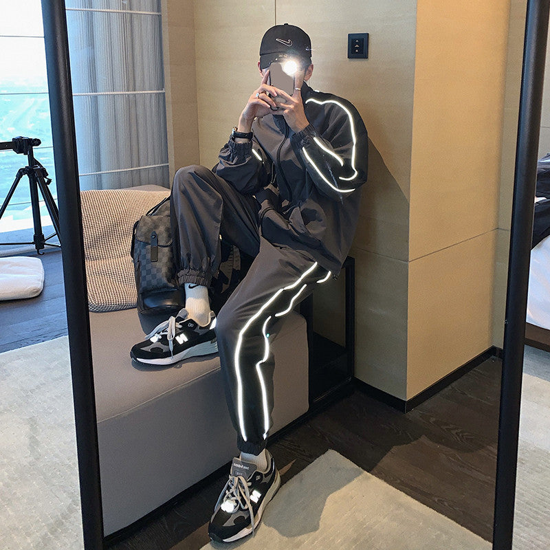 Men's reflective athleisure two piece set featuring a stylish jacket and pants with reflective stripes
