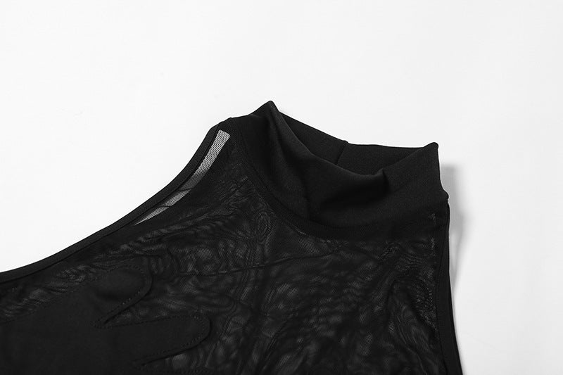 Close-up of a black mesh contrast bodysuit with a stylish neckline and textured fabric