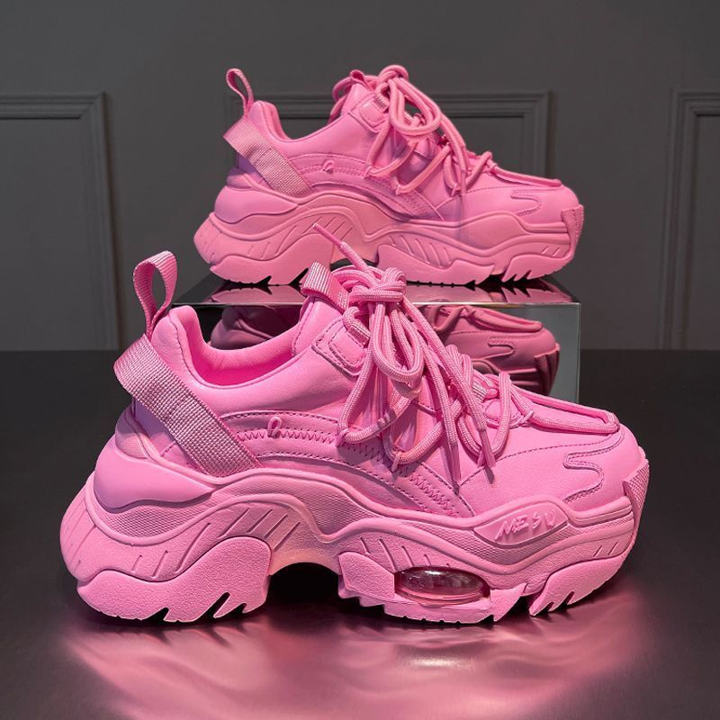 Stylish pink platform athleisure shoes with chunky soles and lace-up design for casual wear