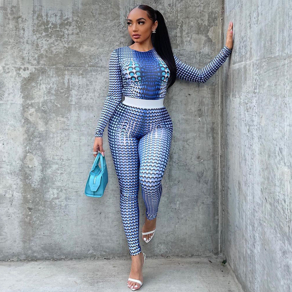 Stylish woman wearing a printed two piece outfit in blue with a fitted design and high waist