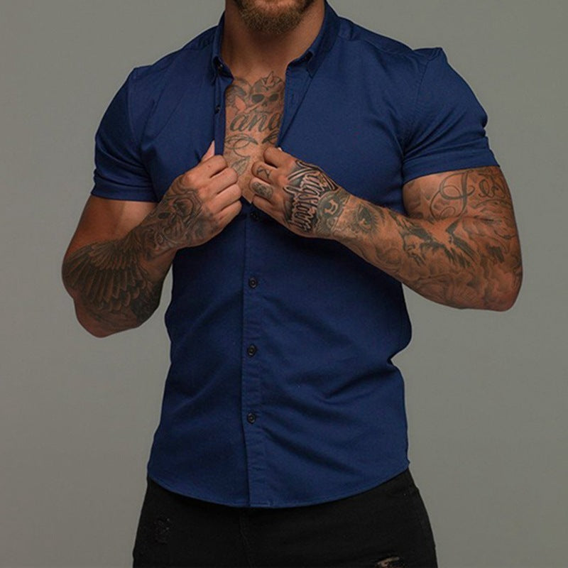 Stylish men's navy shirt with short sleeves, perfect for casual or semi-formal settings, showcasing a modern fit.
