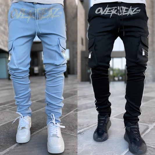 Athleisure cargo pants in light blue and black with stylish zippers and logo design