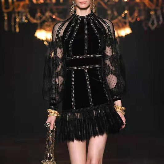 Elegant black beaded sheer dress with puff sleeves and fringed hem for special occasions