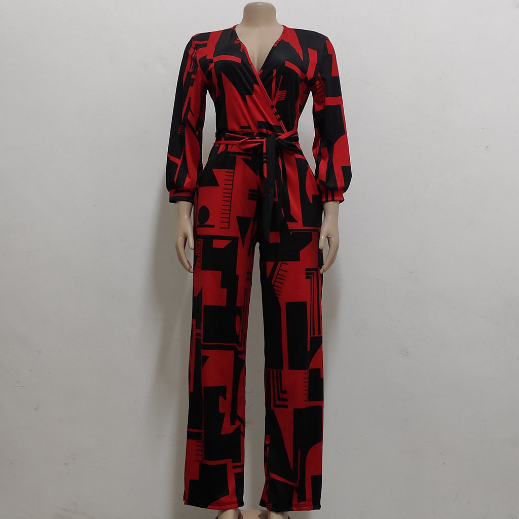 Stylish long sleeve ladies jumpsuit in red and black geometric print with a wrap design