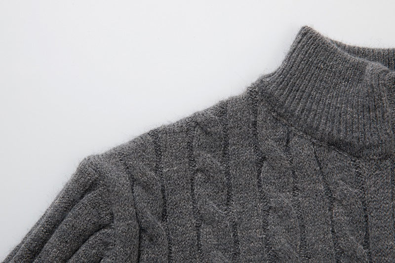 Gray long sleeve cable knit pullover with a cozy turtleneck design