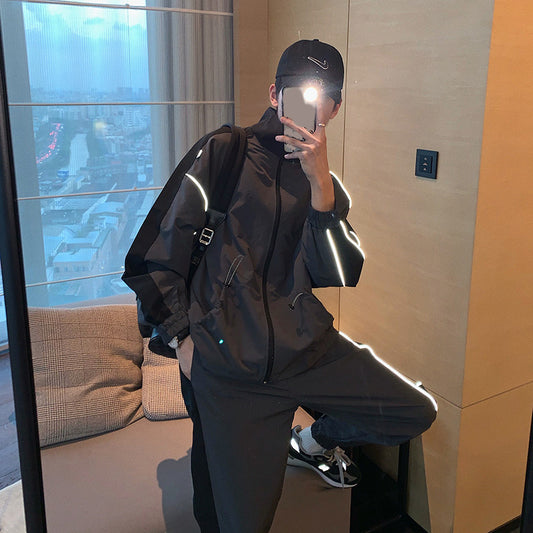 Men's reflective athleisure two piece set in black with stylish reflective details for modern comfort